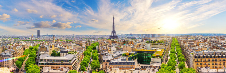 Sunset skyline full panorama of Paris with Eiffel Tower, rooftops and Champs-Elysees