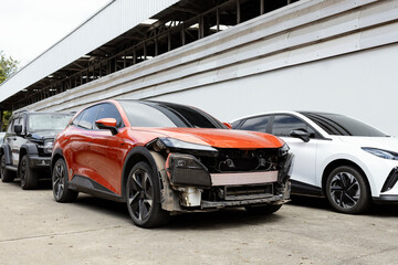 Damaged Car Front After Accident Parked for Repair Automotive Insurance and Collision Damage Concept