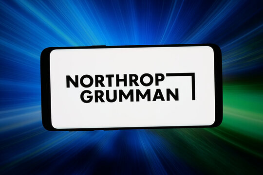 Stuttgart, Germany - 03-09-2026: In this photo illustration, the logo of defence company Northrop Grumman Corporation is displayed on a smartphone in front of abstract background on computer screen.