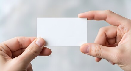 Obraz premium hand holding blank business card