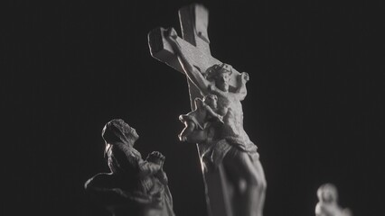 Cinematic View of Grieving Figure Statue Looking Up and Praying to Jesus Christ on Cross, Highlighted by Dramatic Light in Darkness. Spiritual Concept of Prayer and Humility. Praying Figure and Cross.
