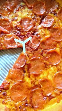 Pepperoni pizza inside of a delivery box, Commercial Italian American Fast Food,  Pizzeria Baked Cuisine, Panning Shot