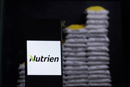Nutrien company logo displayed against a background of fertilizer bags. The Mosaic Company is an American producer and marketer of crop nutrients and fertilizers.