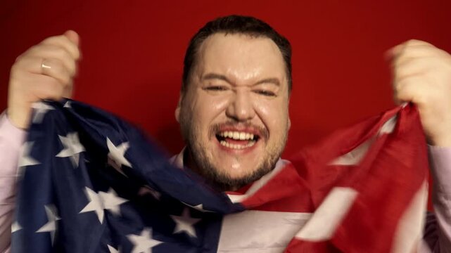 Happy satisfied excited european millennial bearded businessman in suit rejoices in successful deal or win