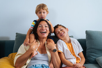 Asian family at home, asian mother and kids laughing having fun together