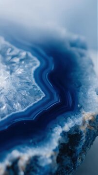 Stunning macro of blue agate geode revealing intricate crystal layers, vibrant colors, and natural patterns perfect for modern design and backgrounds
