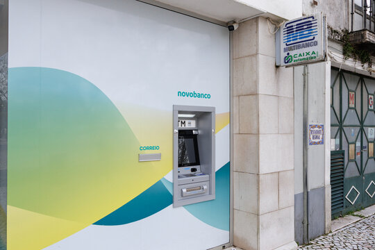 Novo Banco ATM and Multibanco sign on building