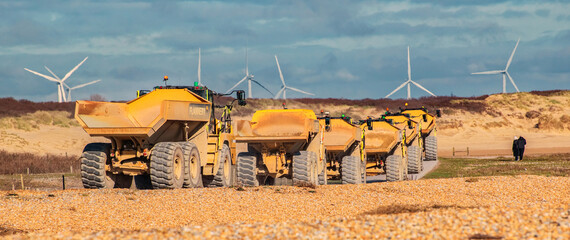 Shingle Beach Yellow Truck convoy © Kenn