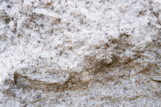 Close up of weathered granite surface texture. Intrusive igneous rock