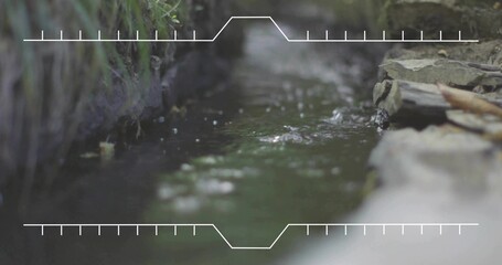 Flowing shallow garden ditch showing ripples and bokeh, bordered by moss bank, stacked stones, HUD
