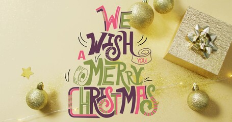 Vertical video: Lettering glowing as fairy lights activating glitter across baubles for card design