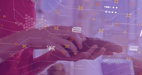 Holding tablet two colleagues tapping touchscreen at meeting showing red sleeve and purple overlays