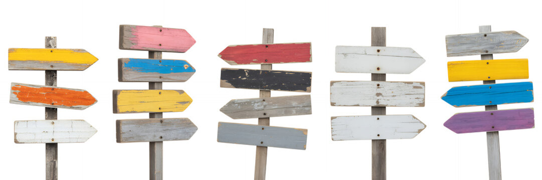 Wooden directional signs on poles with multiple arrows