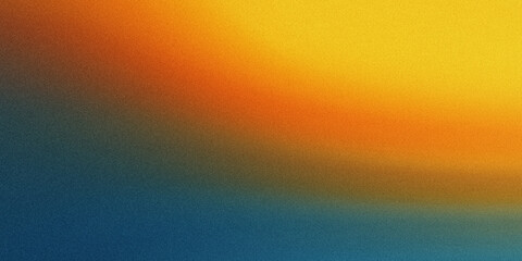 Obraz premium A vibrant gradient of colors transitioning from blue to orange and yellow, creating a warm and inviting atmosphere.