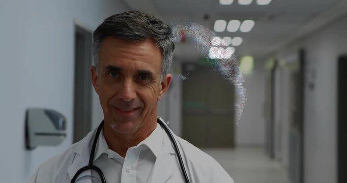 Doctor writing on blue clipboard, activating holo globe casting pixels across face in corridor