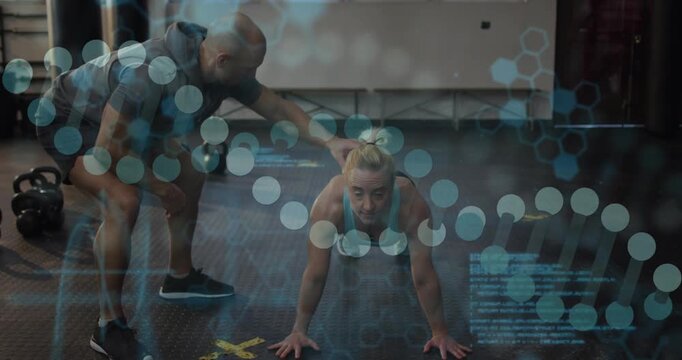 Trainer pointing to yellow X, cueing trainee doing push-ups on gym floor, correcting form under HUD