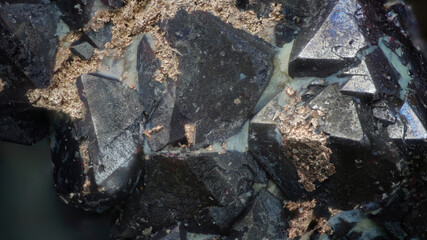 Macro image of native silver metallic formations on cuprite dark red octahedral crystals from Altai, Russia, via microscope, 12x magnification, 3mm field of view