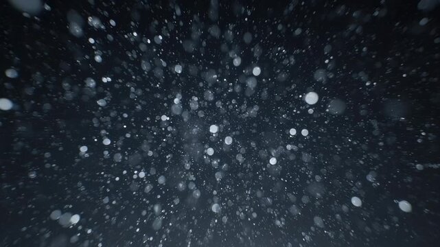 Flying through space dust motes dynamic motion abstract dark background with bokeh effect