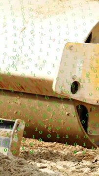 Vertical video: Hydraulic activating drum rotating smoothing soil for paving, green binary overlay