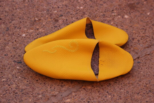 Yellow traditional Moroccan slippers known as babouche