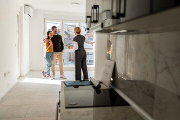 Real Estate Agent Showing Apartment To Customers