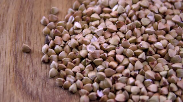 Raw Buckwheat Groats Macro, Fagopyrum Esculentum Seeds o Wooden Background, Organic Gluten-Free Cereal Texture, Detailed Kernel Structure