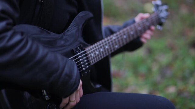 Close-up of playing an electric guitar