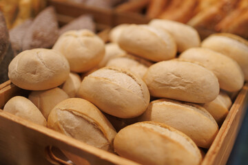 Fresh baked bread rolls arranged at local bakery