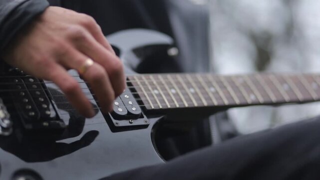 Close-up of playing an electric guitar