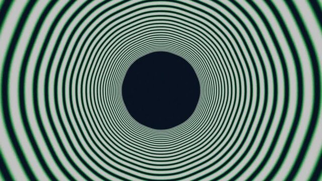 Concentric optical illusion spiral animation with dense green rings forming a hypnotic radial tunnel