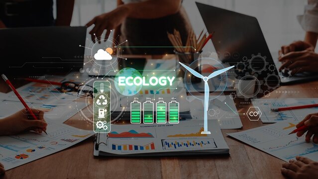 A team collaborates in a workspace, focusing on ecology and renewable energy, with graphics illustrating sustainability trends and data visualization methods. Raster