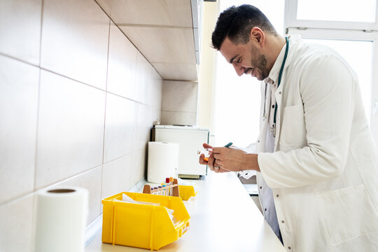 Doctor prepare vaccines in a treatment lab, working carefully with medical equipment. The scene feels sterile and focused, highlighting precision work.