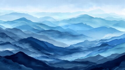 Obraz premium A serene mountain range with misty blue hills and a cloudy sky