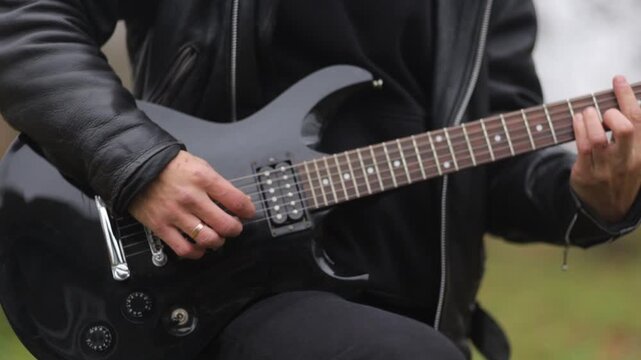 Close-up of playing an electric guitar
