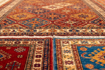 Multi colored woven patterned rugs with intricate traditional designs