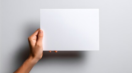 Obraz premium Hand Holding Blank White Paper Card Mockup.