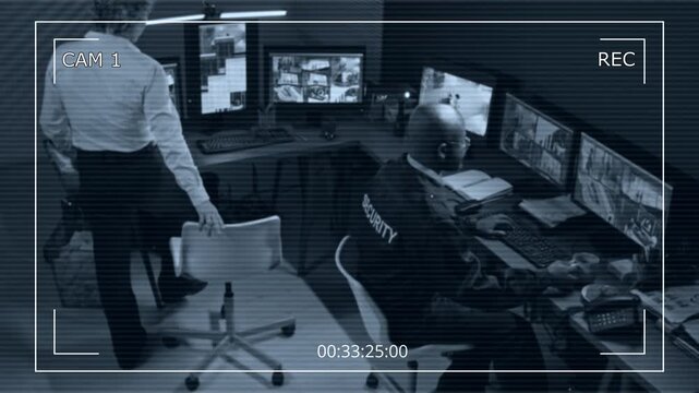Black and white CCTV footage of security control room with two people reviewing multiple computers showing surveillance feed and data, camera interface design