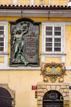 House sign with two suns on the House at the two suns (U Dvou sluncu), where Czech writer Jan Neruda lived, Nerudova 47, Mala Strana neighbourhood, Prague city center, Czechia