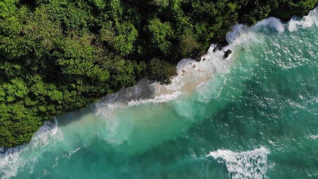 Top down aerial drone shot of Green Bowl Beach at high tide &ndash; Bali, Indonesia