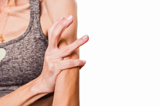 Woman measuring arm, checking body fat percentage