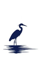 Deep blue silhouette of a wading bird standing in water reflections