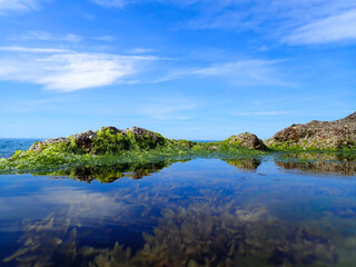Obraz premium Beautiful view of fantastic blue sea background. Mediterranean Sea, Europe. Beauty world, Blue horizon where the cloudless sky and the blue sea converge., Sunset of Mediterranean sea in Jijel Algeria.