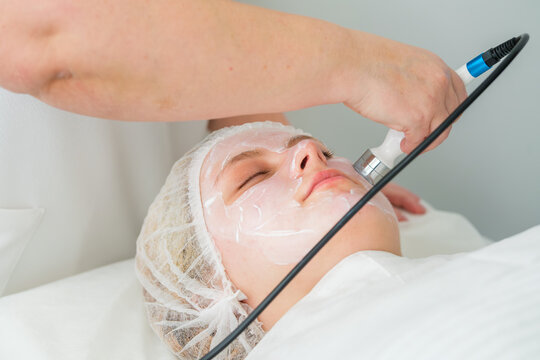 Client enjoys a non-invasive RF lifting procedure at a professional beauty clinic, enhancing skin texture and promoting collagen production.