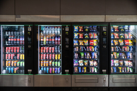 Bruges, belgium 03 08 2026 vending machines offering soft drinks and various snacks in bruges