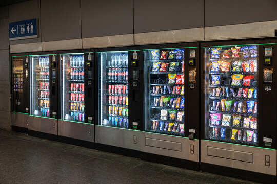 Bruges, belgium 03 08 2026 vending machines offering snacks and drinks inside a station