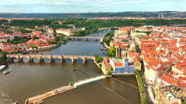 Prague historic bridges above river. Prague aerial perspective with Charles Bridge. Prague Charles Bridge districts. Prague cityscape with old architecture.