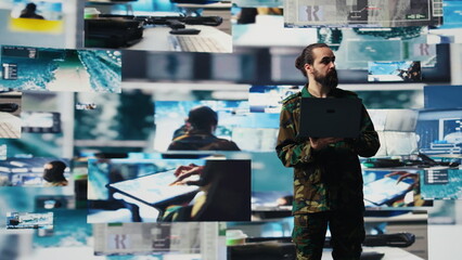 Officer monitoring real time combat data using advanced military systems, cyber tactics and digital...