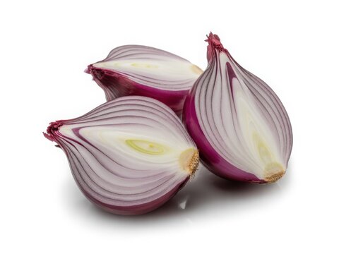 Fresh red onion with papery outer layers and vibrant purple tips
