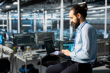 Admin monitoring LLM model in data center with gear managing AI training datasets. IT specialist...