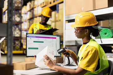 African american staff registering shipment details on awb tags, scanning tracking numbers in...